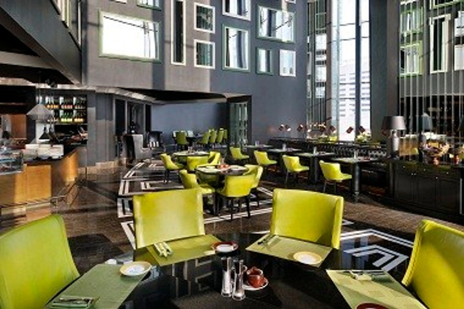 Modern dining area with lime green chairs, JW Marriott Dubai.