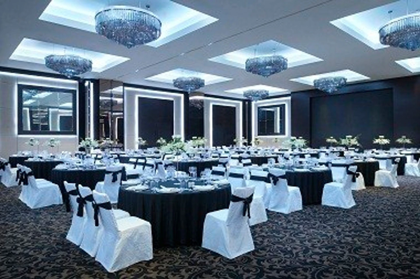 Chic ballroom with round tables, JW Marriott Marquis Dubai.