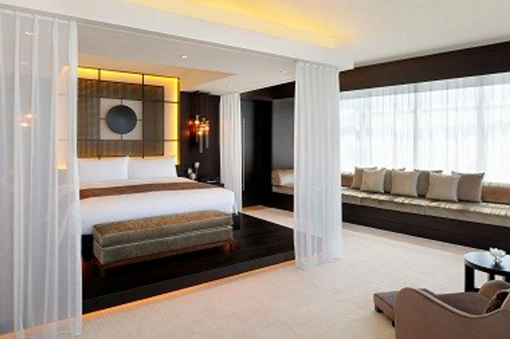 Luxurious suite at JW Marriott Marquis Hotel Dubai with modern decor.