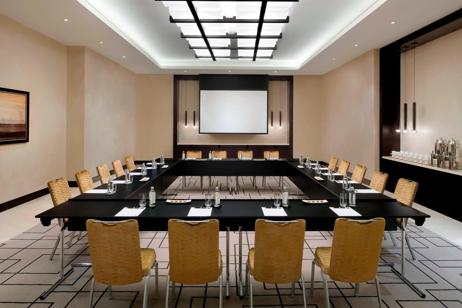Conference room at JW Marriott Marquis Hotel Dubai with U-shaped table.
