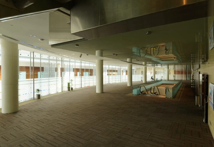 Spacious interior of Dubai World Trade Centre with glass walls.