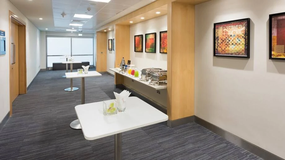 Dubai World Trade Centre hallway with tables and colorful artwork.