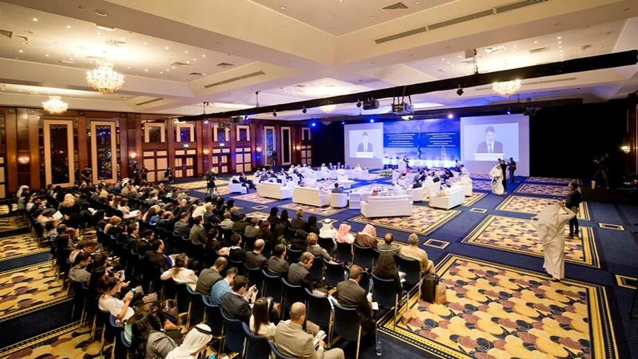 Conference at Dubai World Trade Centre with large audience.