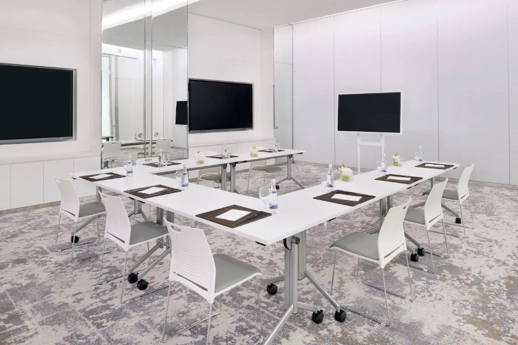 Contemporary meeting room with screens, Arjaan by Rotana, Dubai Media City.