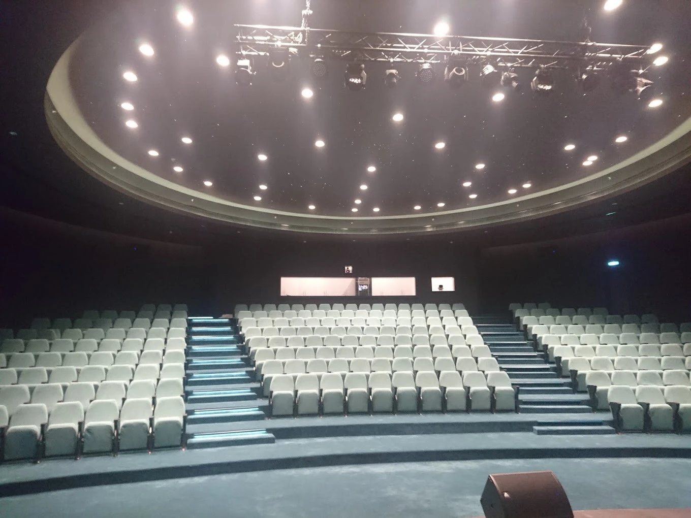 Empty Conference Hall Dubai Knowledge Park with tiered seating and stage