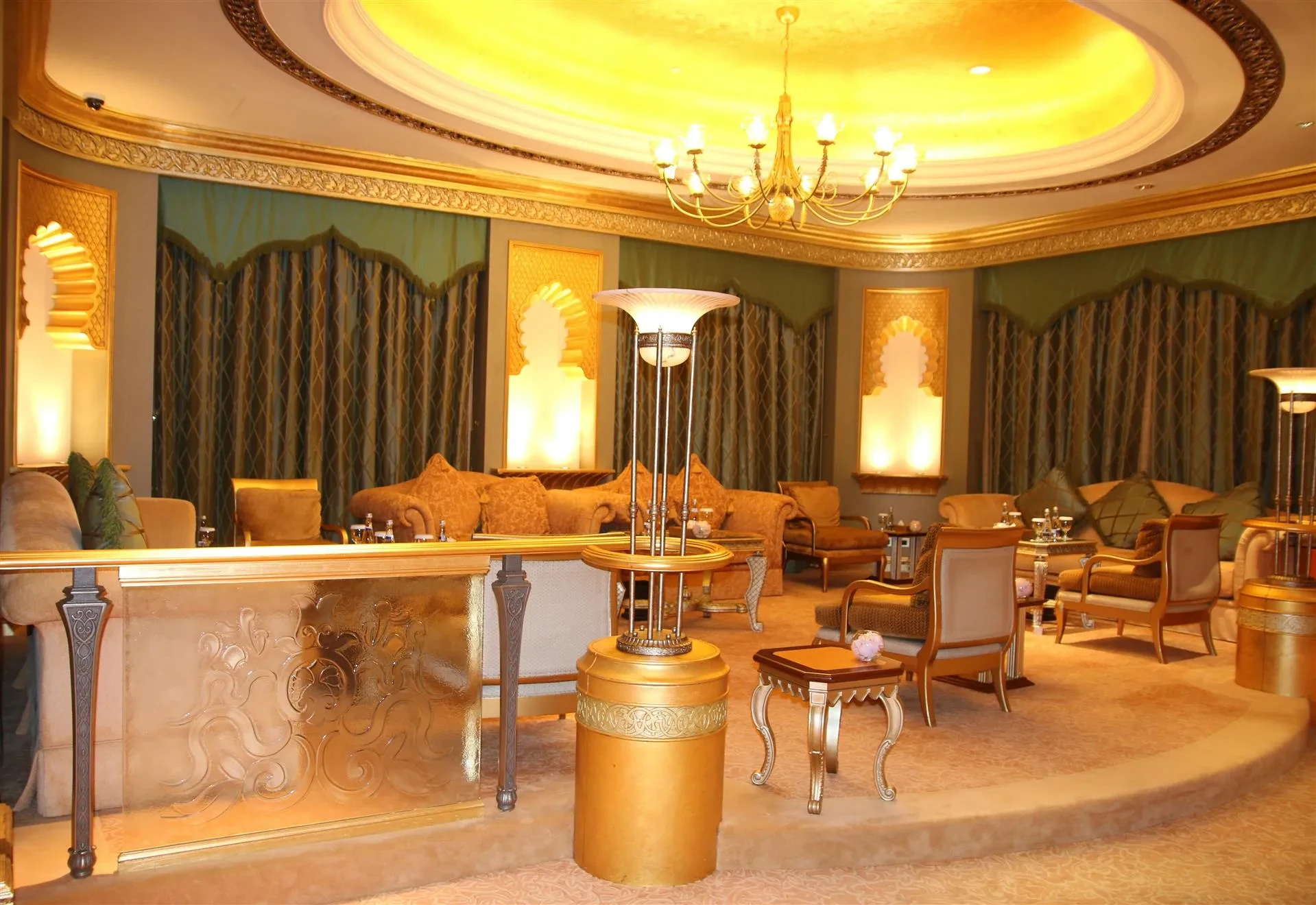 Opulent seating area with golden decor, Emirates Palace, Abu Dhabi.