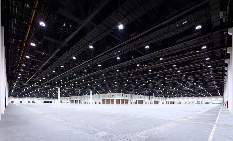 Spacious exhibition hall at ADNEC Centre Abu Dhabi, well-lit and empty.