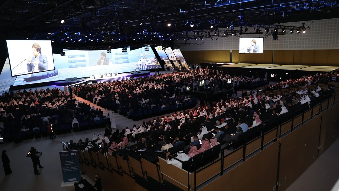 Conference at ADNEC Centre Abu Dhabi with large audience and stage.