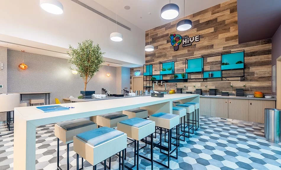 Modern lounge area at ADNEC Centre Abu Dhabi with seating and decor.