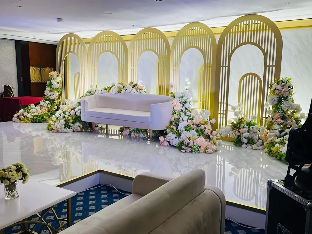 Elegant floral stage setup at All Seasons Hotel Al Ain.