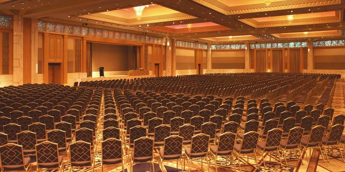 Spacious ballroom with rows of chairs, Grand Hyatt Dubai Convention Centre.