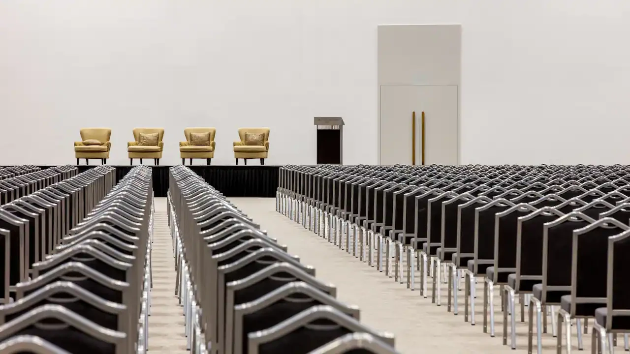 Grand Hyatt Dubai theatre setup with podium and chairs