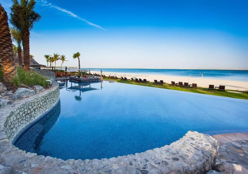 Infinity pool overlooking beach at JA Beach Hotel, Dubai.