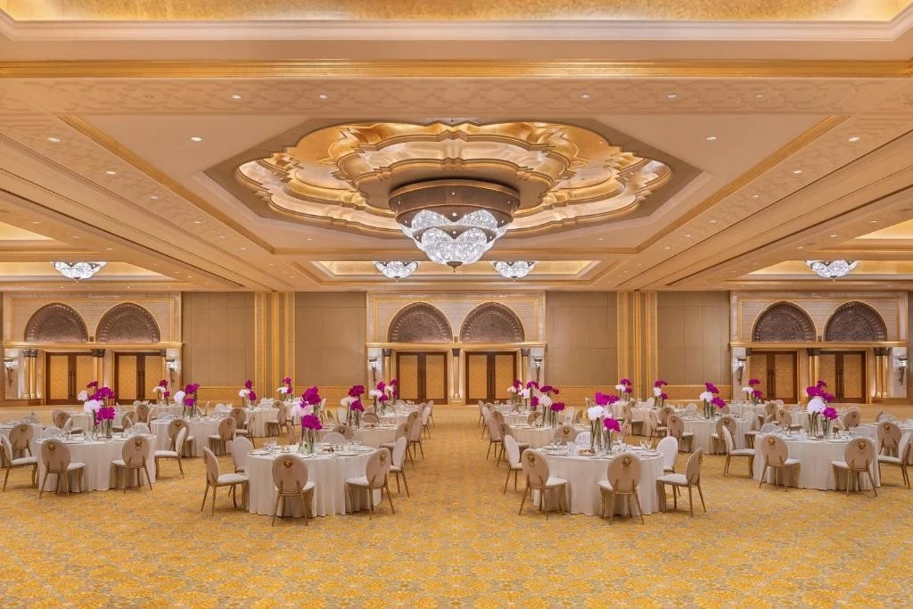 Luxurious ballroom at Emirates Palace Mandarin Oriental, Abu Dhabi, with chandeliers.