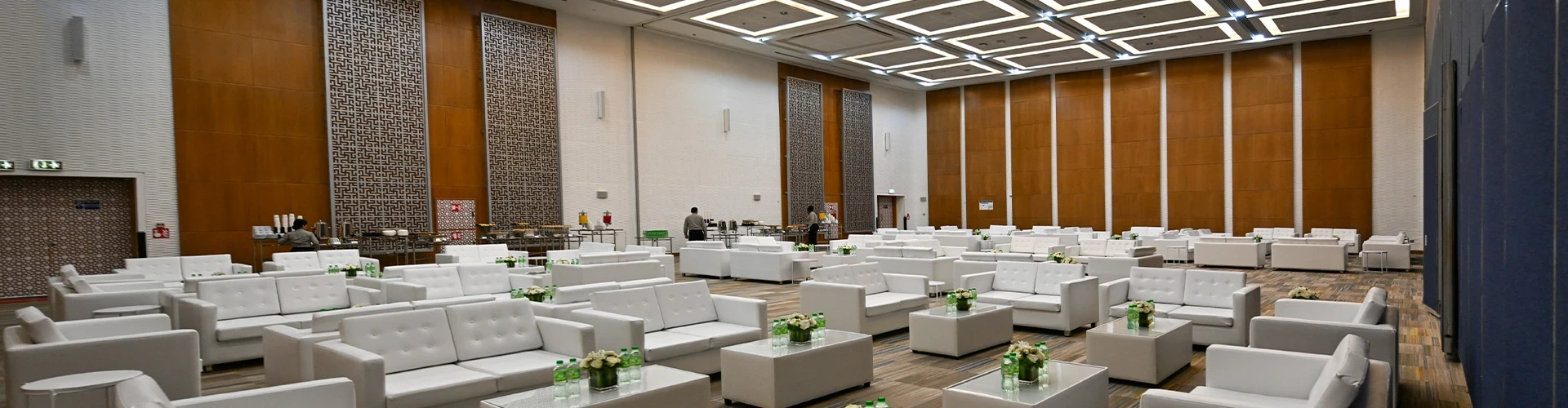 Spacious conference hall with white seating at ADNEC Centre, Abu Dhabi.