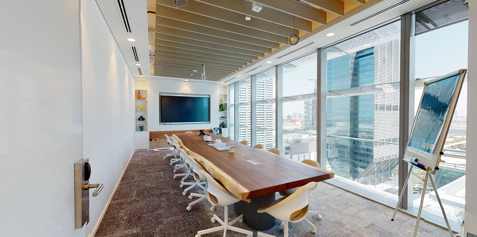 Spacious meeting room with wooden table, Cloud Spaces ADGM, Abu Dhabi.