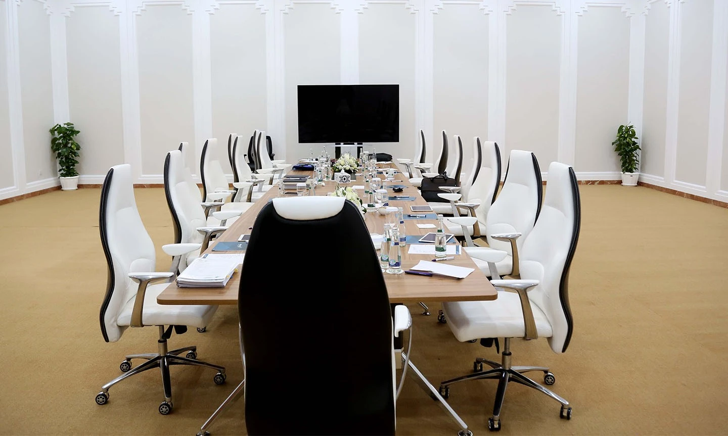 Conference room at ADNEC Centre Al Ain with modern chairs.