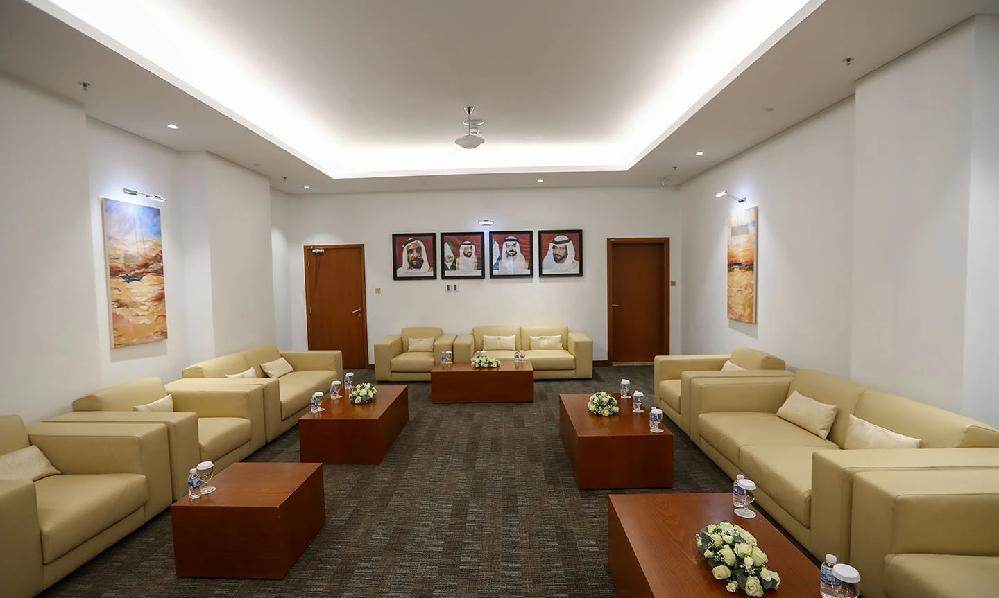 Elegant seating area at ADNEC Centre Al Ain with beige sofas.