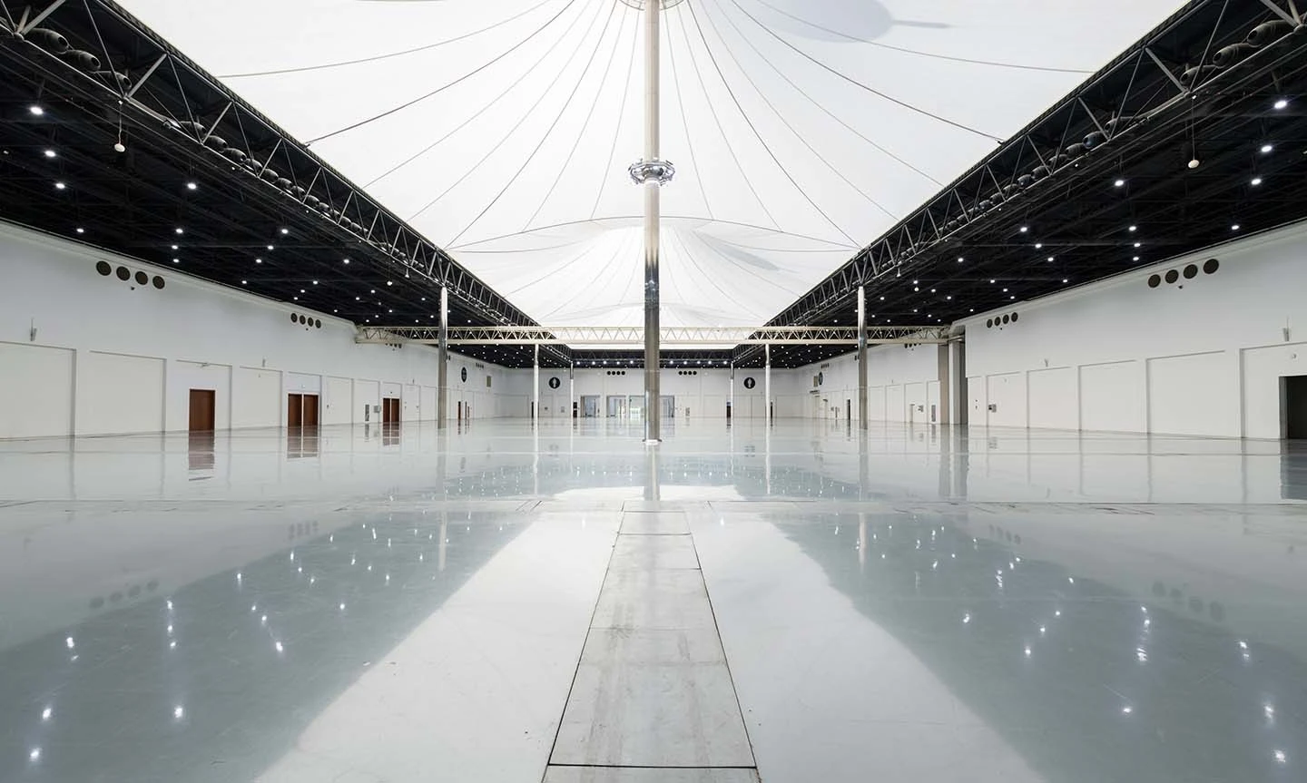 Expansive hall with reflective floor at ADNEC Centre Al Ain.