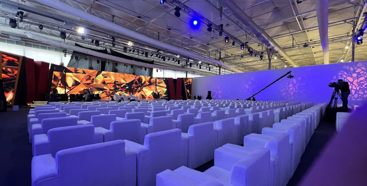 Riyadh Convention Center auditorium with stage and seating, vibrant lighting
