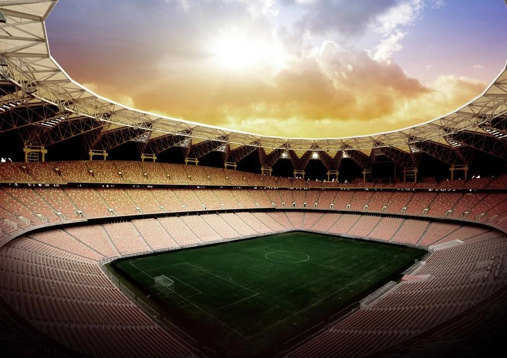 King Abdullah Sport City stadium in Jeddah at sunset.