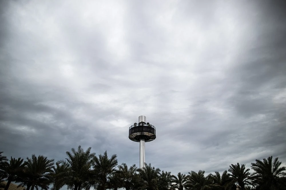Garden In The Sky tower at Expo City Dubai under cloudy sky.